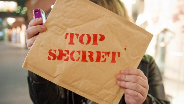 An envelope that says 'top secret on it'