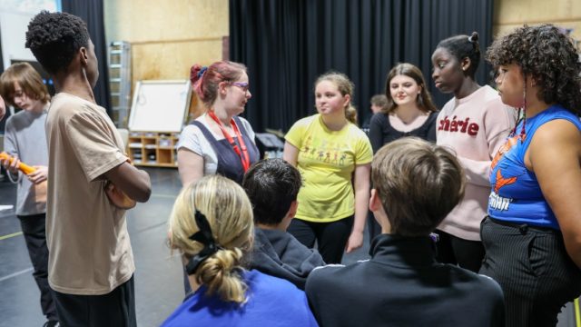 A group of young people in a circle