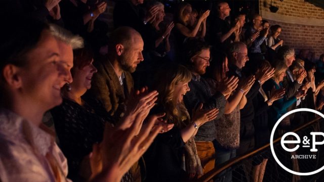 A crowd applauding