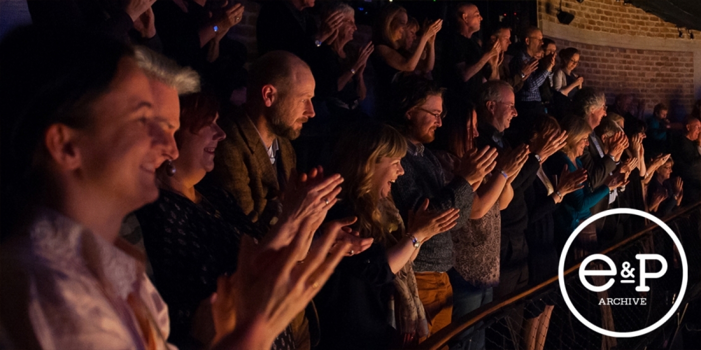 A crowd applauding