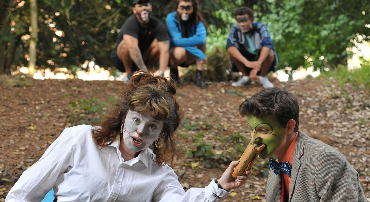 A group with animal face paint on in a park