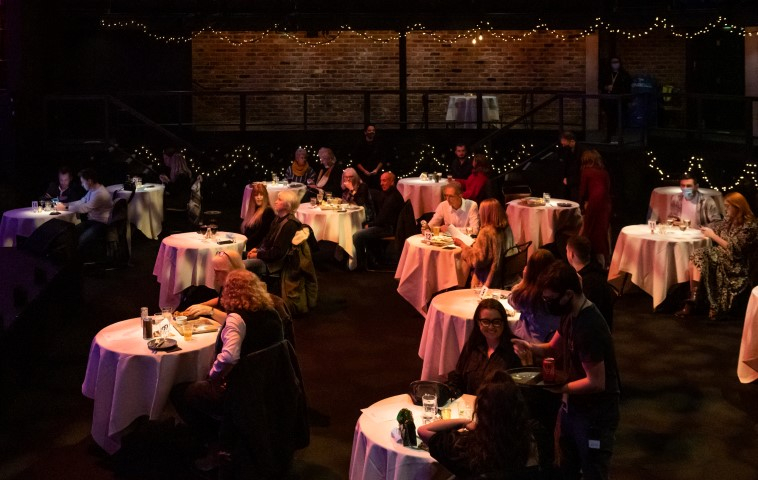 The crowd sat on circle tables