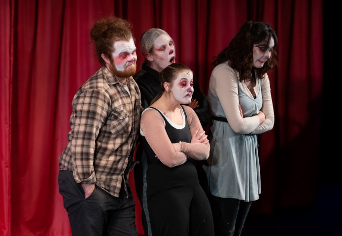 Four people with clown makeup on