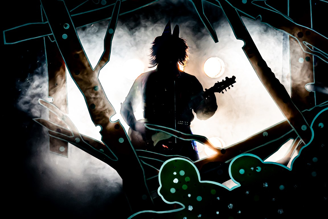 A silhouette of the big bad wolf holding a guitar