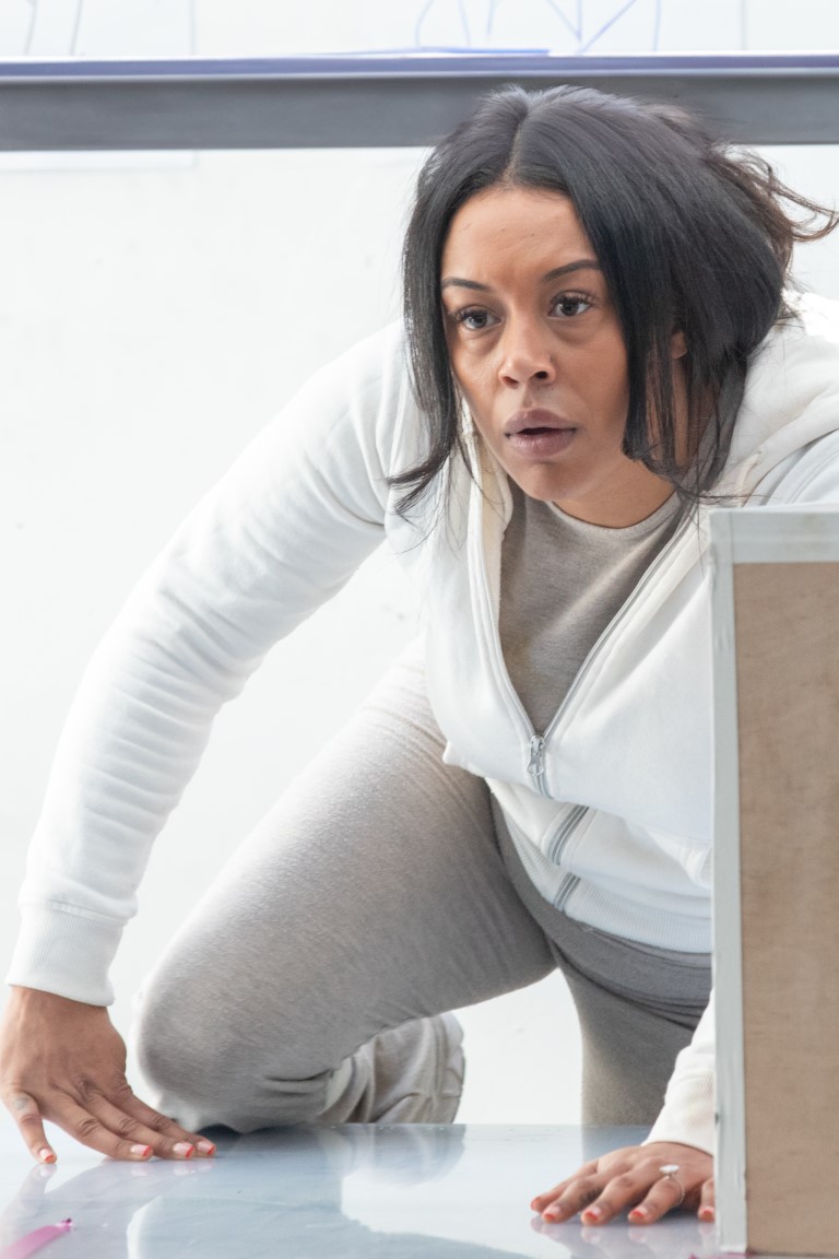 A woman crawling on the floor